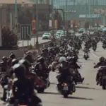 group of people riding motorcycles on highway